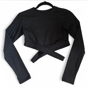 Black long sleeve tight crop top with criss-cross detail